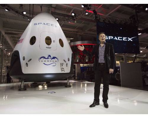 Elon Musk with Dragon Capsule